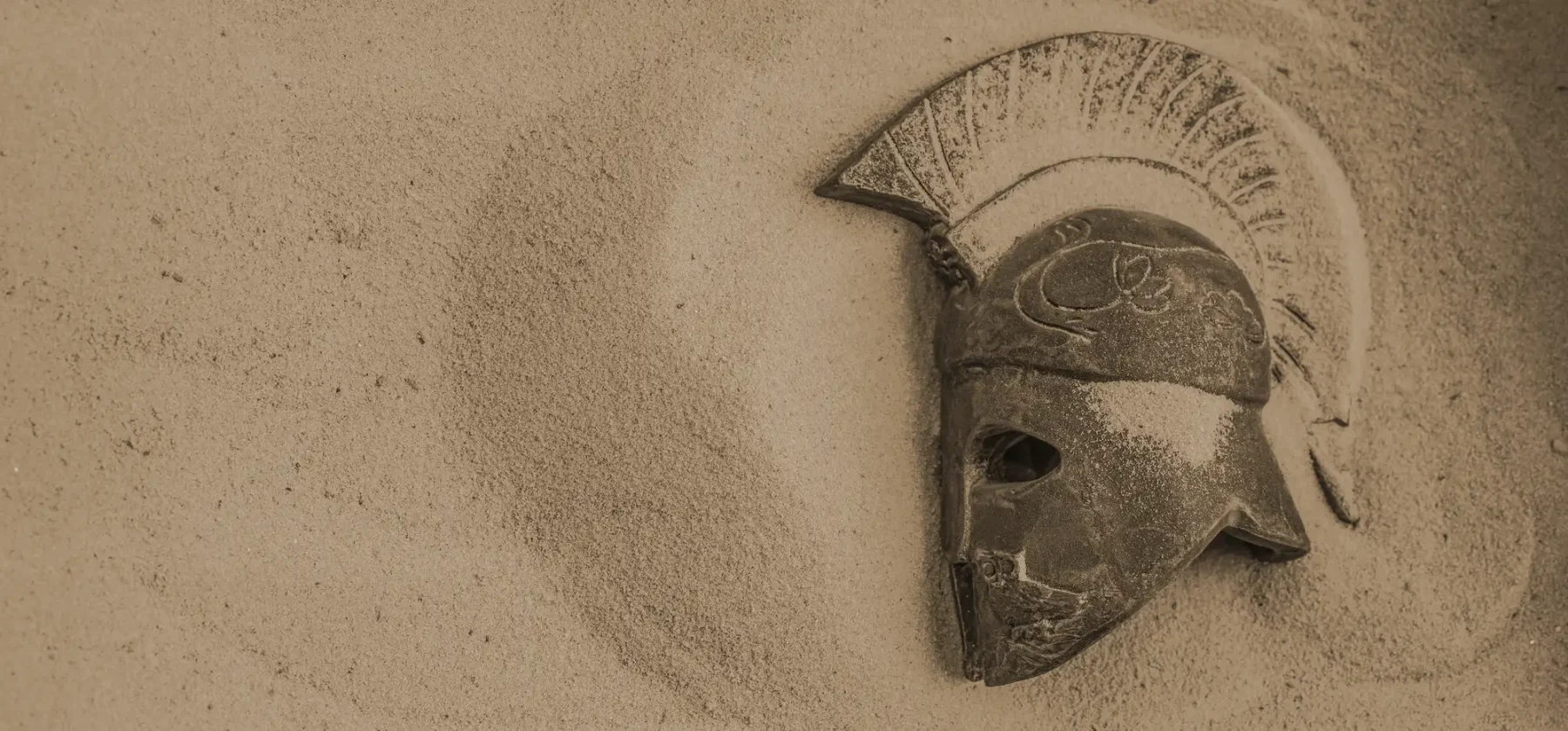 Roman helmet in sand