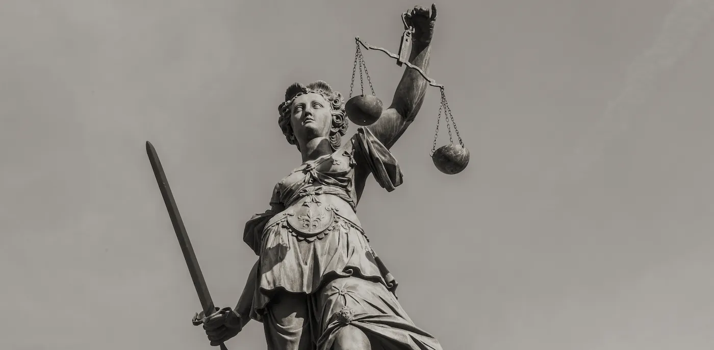 Statue of Lady Justice holding a sword and scales