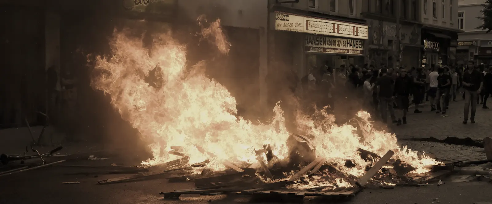 fire in the street set by protesters